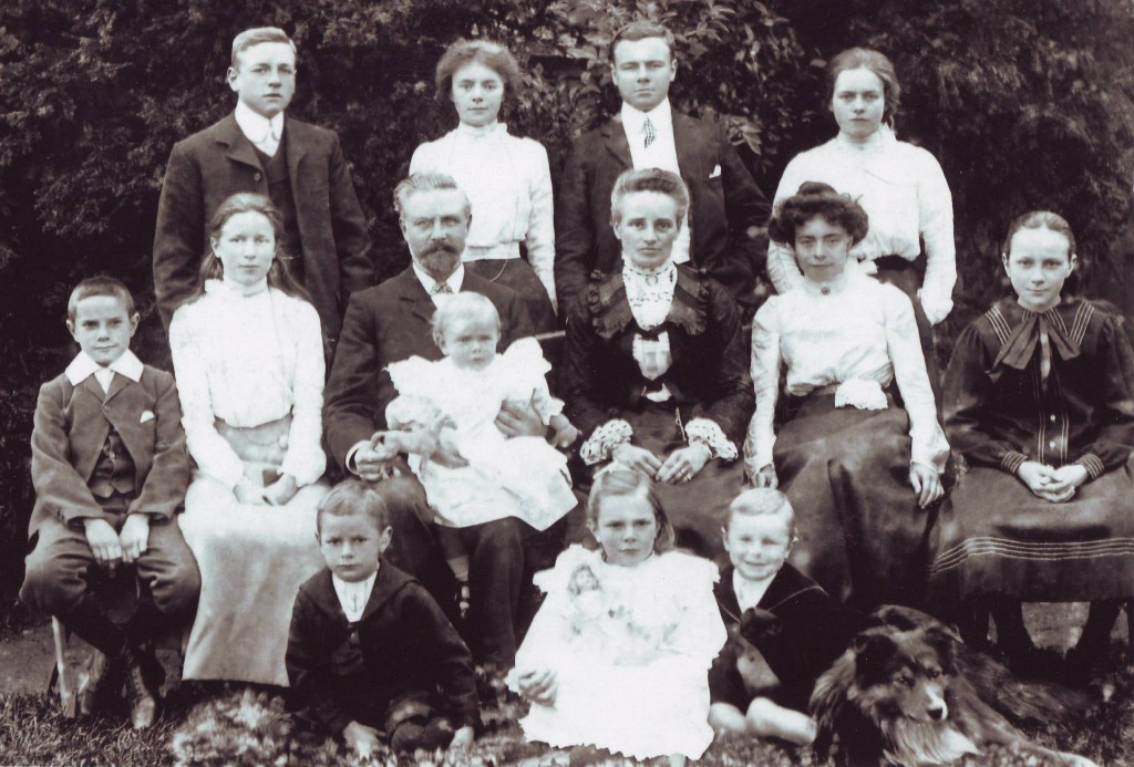 The Fisher family in their garden in Tyler Strett before 1914. Percy is standing first left, Raymond is standing second right